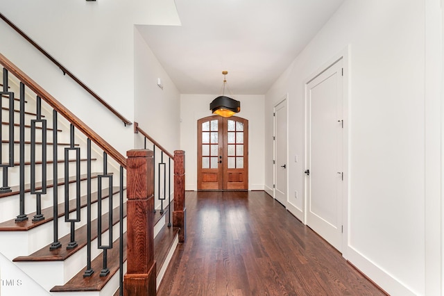 entrance foyer with french doors and dark wood-type flooring