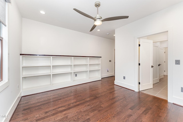 unfurnished room featuring ceiling fan and hardwood / wood-style floors