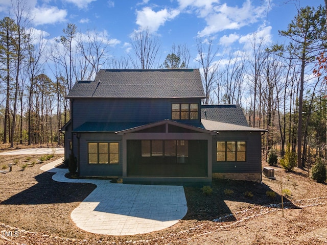 back of house featuring central AC unit and a patio