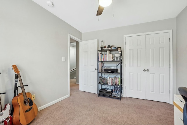 misc room with ceiling fan and light colored carpet