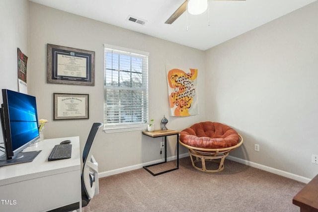 home office featuring light colored carpet and ceiling fan