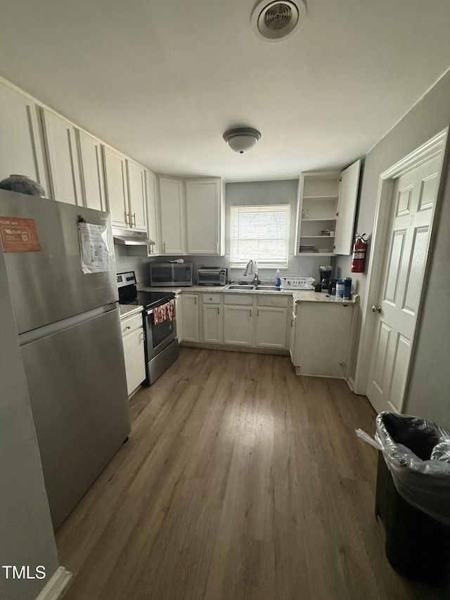 kitchen with white cabinetry, sink, light hardwood / wood-style flooring, and stainless steel appliances