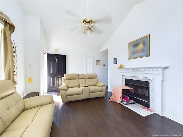 living room with wood-type flooring, high vaulted ceiling, a premium fireplace, and ceiling fan