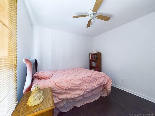 bedroom with dark wood-type flooring and ceiling fan