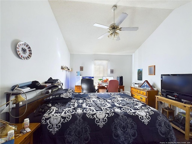 bedroom with vaulted ceiling, a textured ceiling, and ceiling fan