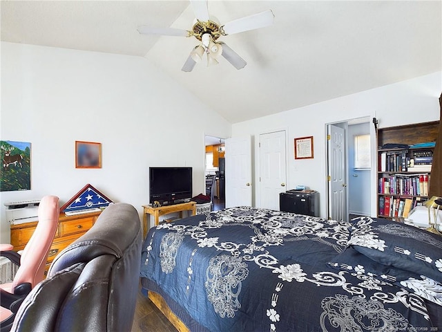 bedroom featuring ceiling fan, vaulted ceiling, and wood-type flooring