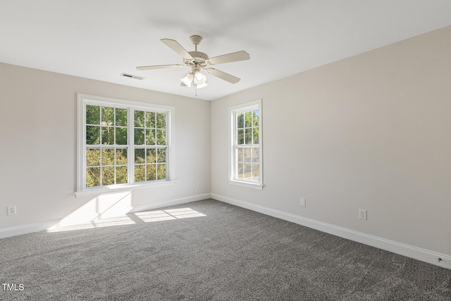 empty room featuring ceiling fan and carpet flooring