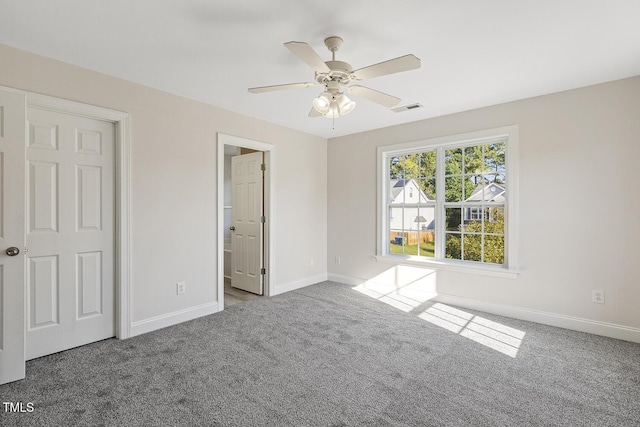 unfurnished bedroom with ceiling fan and carpet flooring