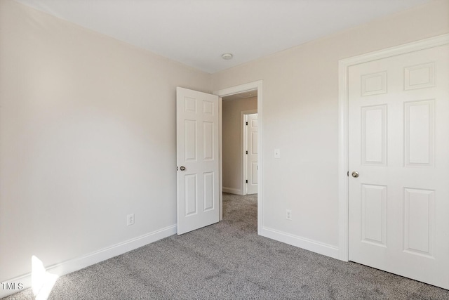 unfurnished bedroom with carpet floors