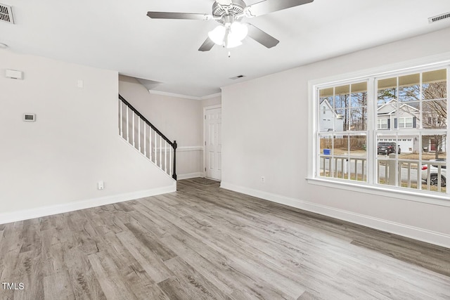 unfurnished living room with ceiling fan and light wood-type flooring