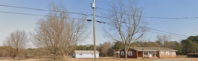 view of front facade featuring an outbuilding