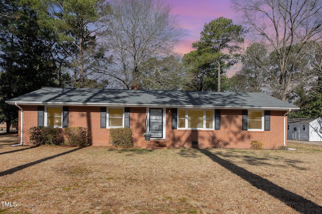 single story home featuring a yard