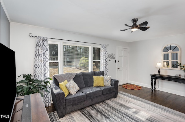 living room featuring hardwood / wood-style floors and ceiling fan