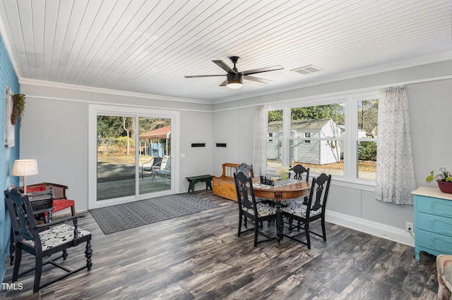 dining space with dark wood-type flooring, ceiling fan, and crown molding