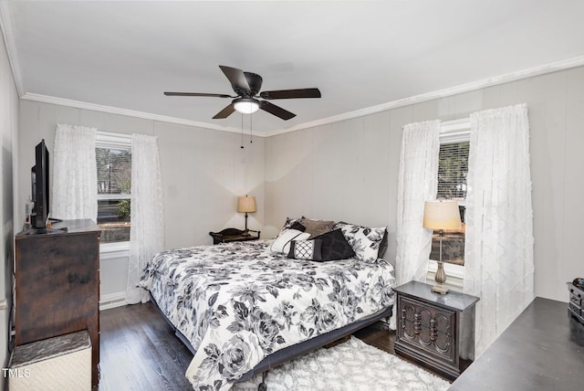 bedroom with crown molding, dark wood-type flooring, and ceiling fan