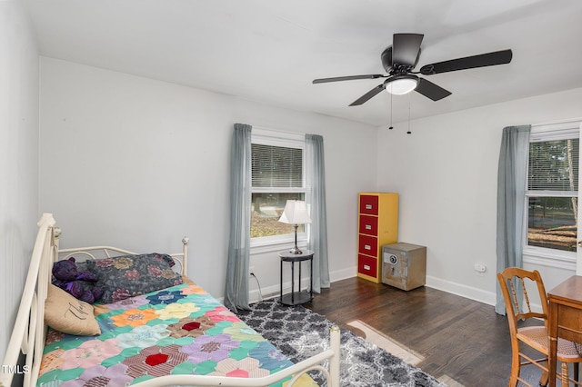 bedroom with dark wood-type flooring and ceiling fan