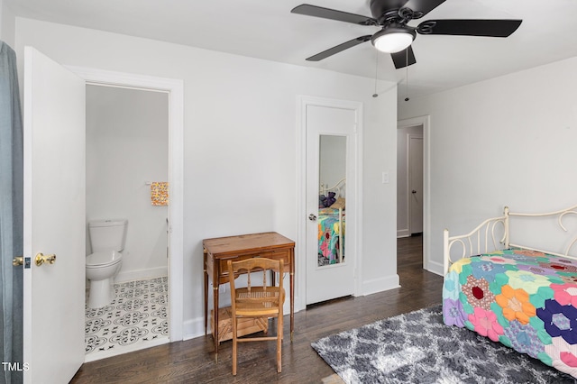 bedroom with dark hardwood / wood-style floors, ceiling fan, and ensuite bathroom