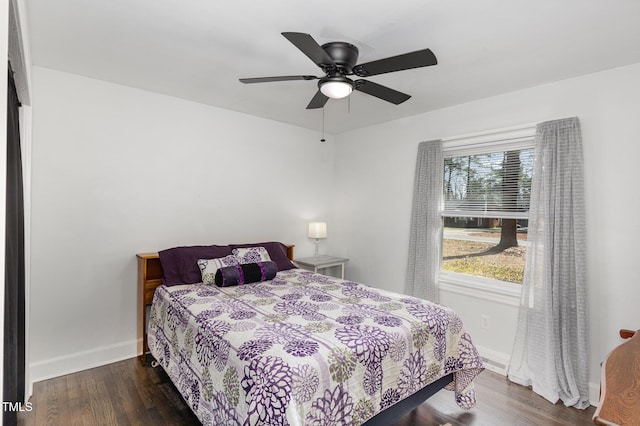 bedroom featuring dark hardwood / wood-style flooring and ceiling fan