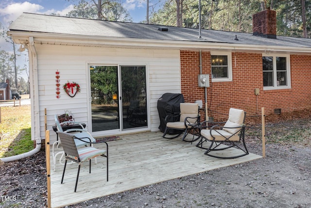 back of house with a wooden deck