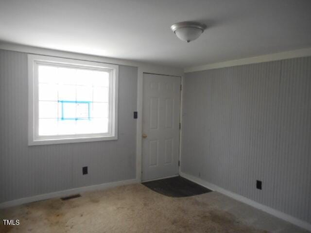 entrance foyer featuring light carpet