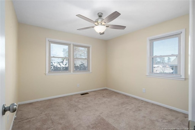 carpeted empty room with ceiling fan