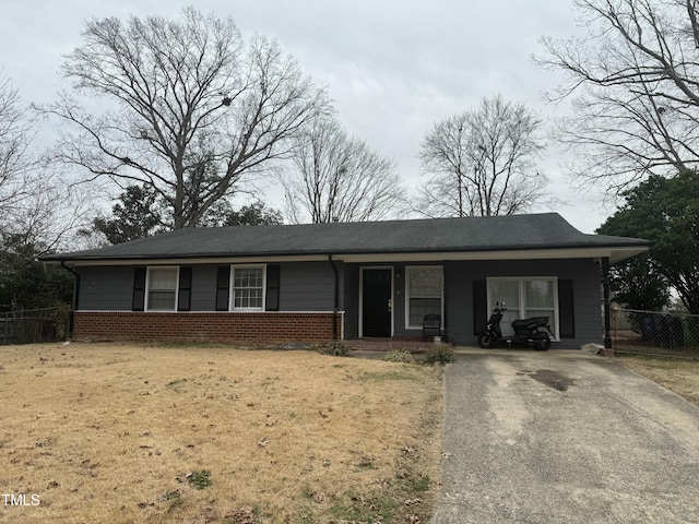 view of front of property with a carport and a front yard