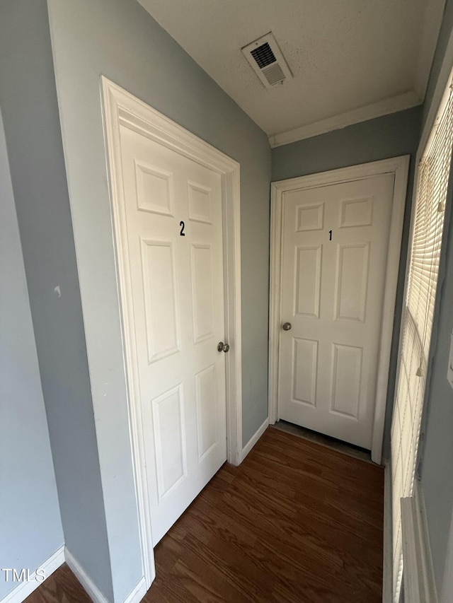 hallway featuring dark hardwood / wood-style flooring