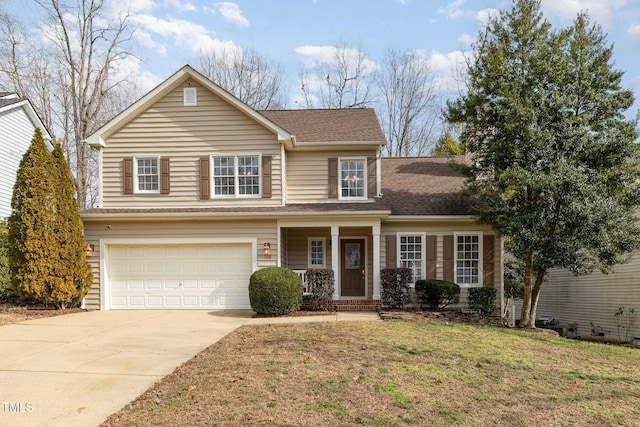 view of front of property with a garage and a front yard