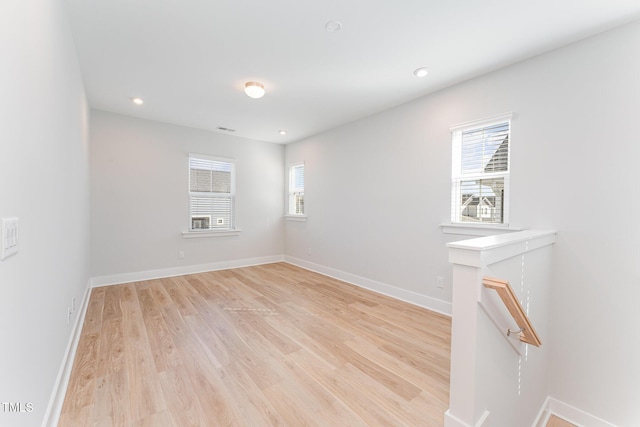 empty room with light hardwood / wood-style floors