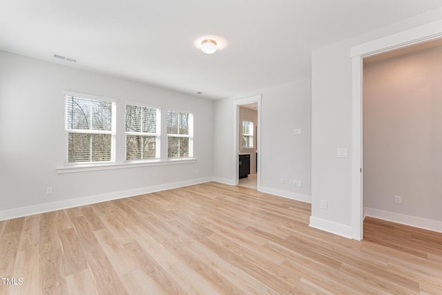 unfurnished room with light hardwood / wood-style flooring