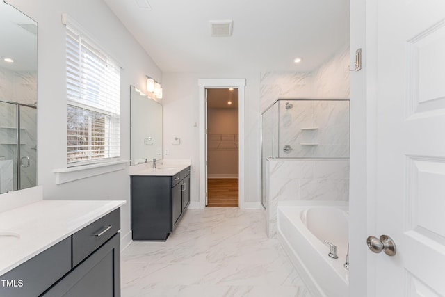 bathroom with vanity and plus walk in shower