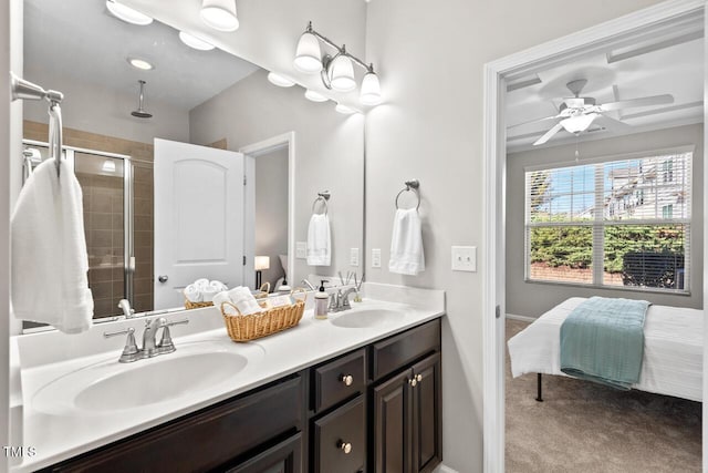 ensuite bathroom featuring double vanity, tiled shower, ensuite bathroom, and a sink