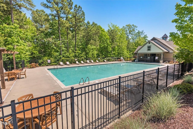 pool featuring a patio and fence