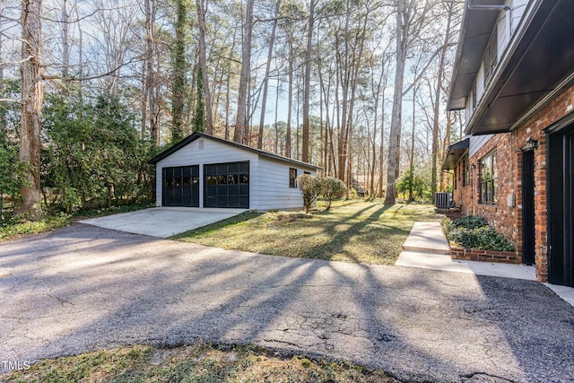 detached garage featuring central AC