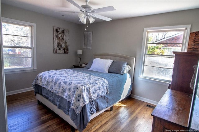 bedroom featuring dark wood-type flooring and ceiling fan