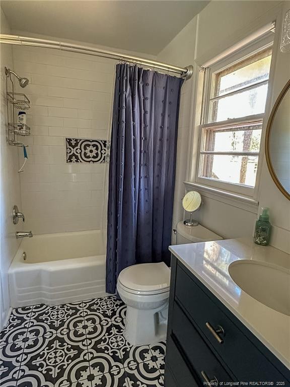 full bathroom with vanity, tile patterned floors, toilet, and shower / bath combo