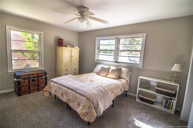 bedroom with ceiling fan, carpet flooring, and multiple windows