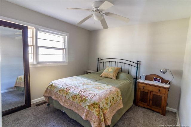 bedroom featuring ceiling fan and light carpet