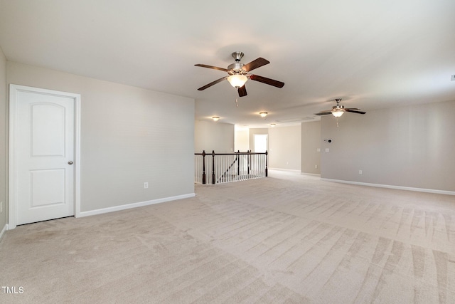 unfurnished room with light colored carpet