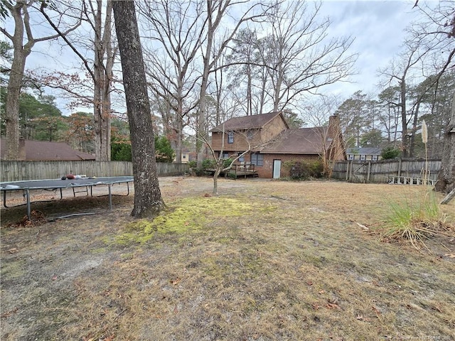 view of yard featuring a trampoline