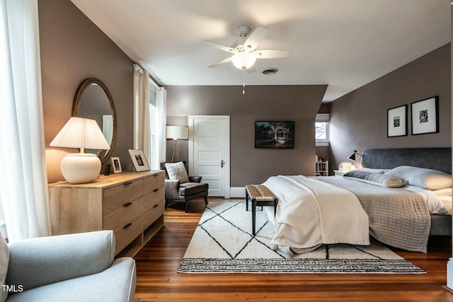 bedroom with dark wood-type flooring and ceiling fan