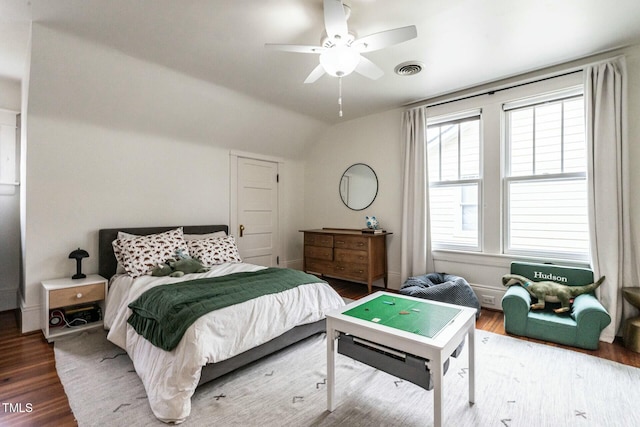 bedroom featuring hardwood / wood-style flooring, lofted ceiling, and ceiling fan