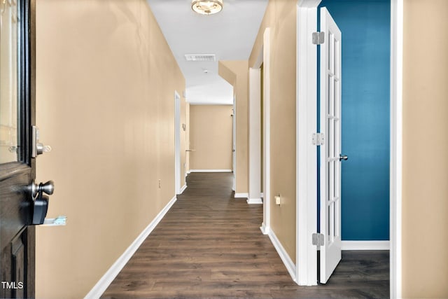 corridor with dark wood-type flooring