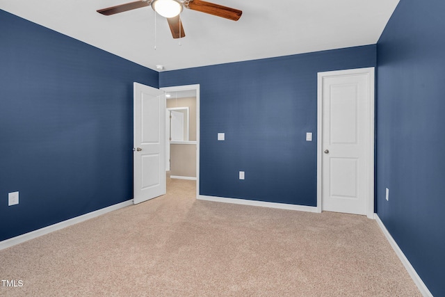 unfurnished bedroom with light carpet and ceiling fan