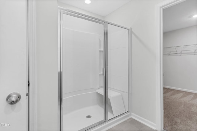 bathroom featuring an enclosed shower