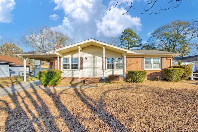 ranch-style house with a carport