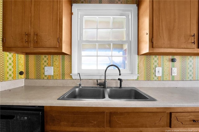 kitchen with sink, decorative backsplash, and dishwasher