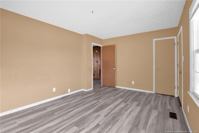 unfurnished bedroom with light hardwood / wood-style flooring