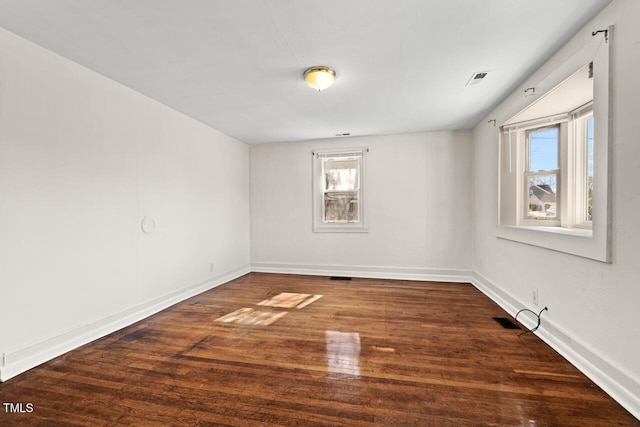 empty room featuring dark wood-type flooring