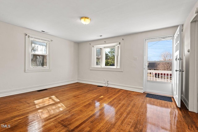 spare room featuring hardwood / wood-style floors